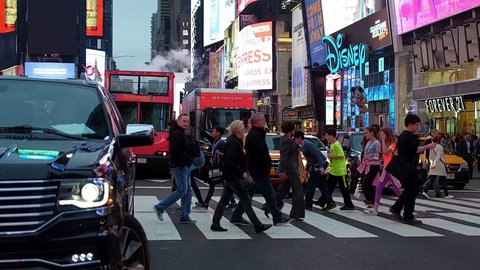 
NEW YORK CITY, Circa 2017. Crowded Times Square, the greatest commercial intersection, tourist destination and entertainment center in Manhattan. NY, United States. Slow motion