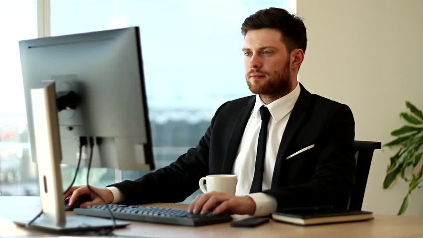 Businessman working on Computer. Routine Work at Office. Business