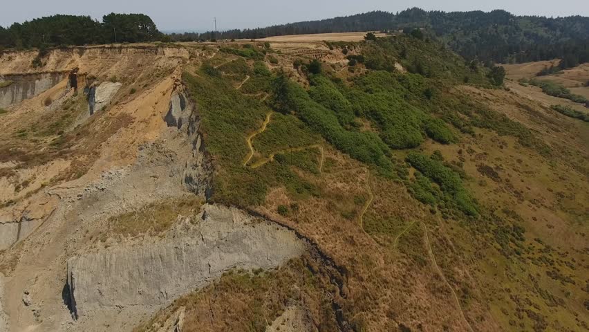 Panning over a sandy beach trail