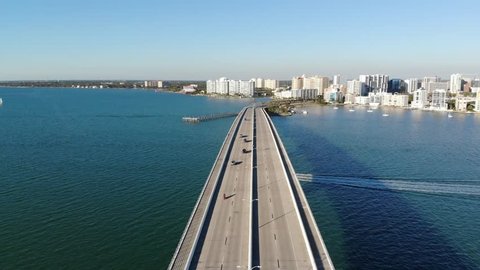 A drone view across the John Ringling Causeway heading towards Downtown Sarasota, Florida.