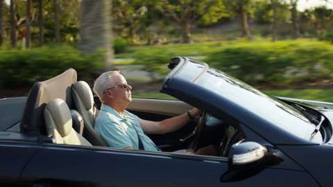 Active Senior Man Drives His Luxury Convertible In Sunny Florida - Shot On Red Scarlet-W Dragon In 4K/ Slow Motion