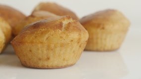 Slow tilt on muffin cornmeal close-up 4K 2160p 30fps UltraHD footage - Cornbread baked and arranged on plate 3840X2160 UHD tilting video