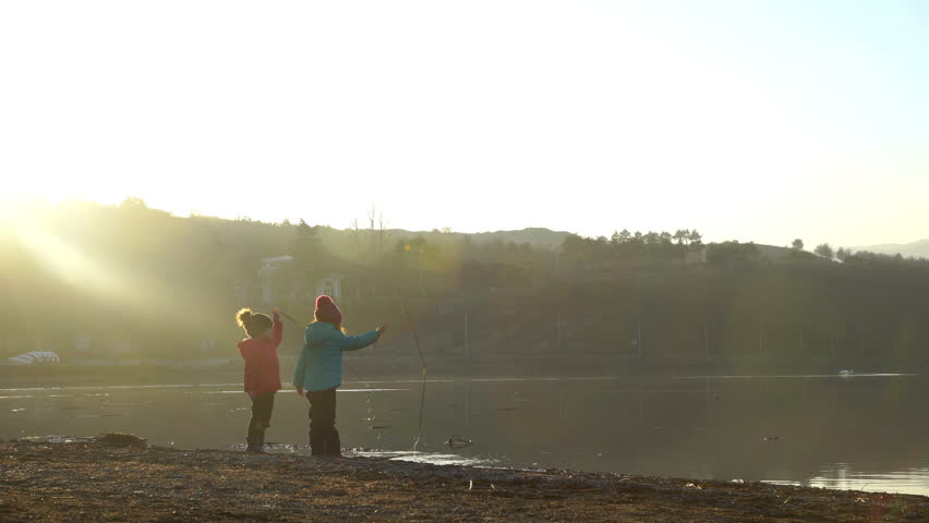 Children Play Near the Dirty Lake Royalty-Free Stock Footage #1009401110