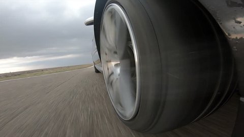 Car wheel with incandescent ceramic brakes and  sparks on race track with sound