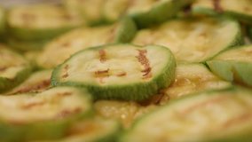 Close-up of Pepo cylindrica slices on plate 4K 2160p 30fps UltraHD footage - Steam evaporates from zucchini  3840X2160 UHD video