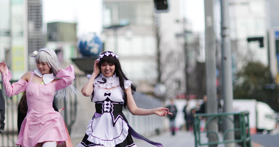 Japanese female friends running across crossing, Harajuku, Tokyo, Japan Royalty-Free Stock Footage #1009413509