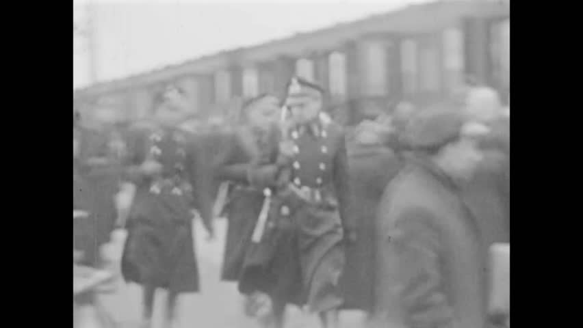 CIRCA 1940s - Prisoners arrive from Camp Vught by train to the Westerbork Concentration Camp and are registered, in the Netherlands.