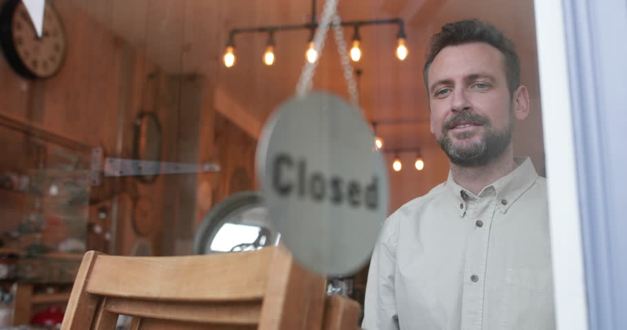 Small business owner opening store