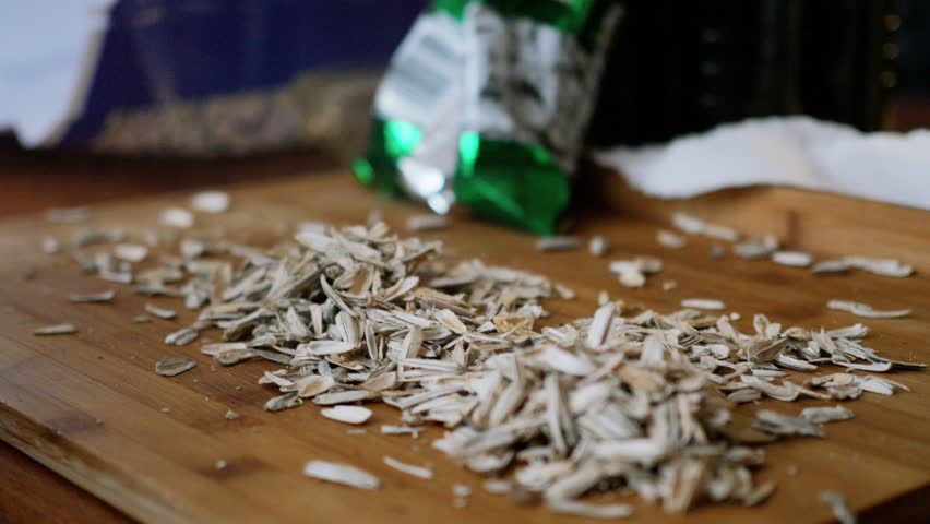 eating, husking, shelling sunflower seeds