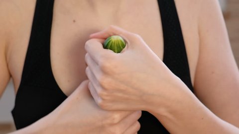 Closeup woman hands holding cucumber and play with it. Safe sex concept.