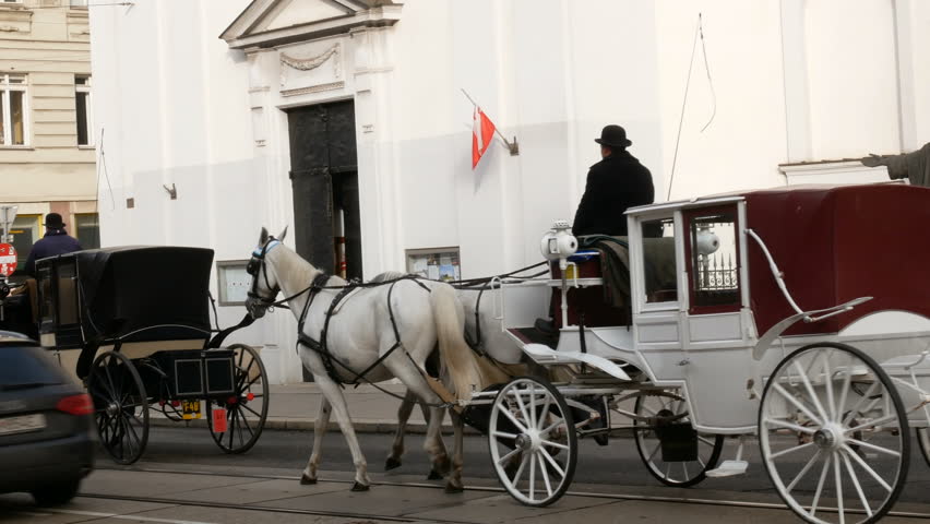 Horse-drawn carriages carrying tourists around, Vienna Austria