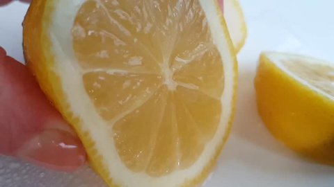hands lemon squeeze slow-motion
 
