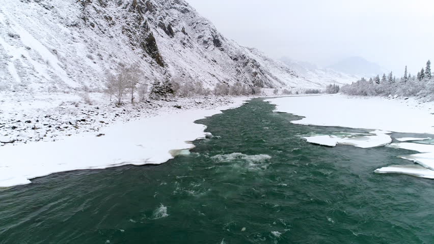 aerial view winter mountain river ice
