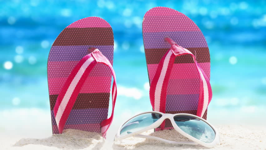 Cinemagraph: flip-flops against the sparkling tropical sea background Royalty-Free Stock Footage #1009474451