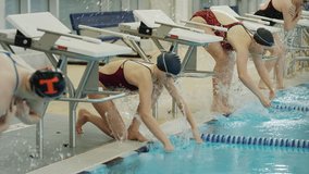 Girls splashing water and warming up before swimming race / Provo, Utah, United States