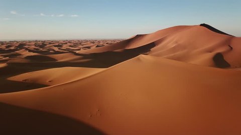 Aerial view on big sand dunes in Sahara desert at sunrise, Africa, 4k