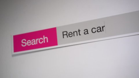 Rent a car - browser search query online, typing in the search term into Internet. Search web form, tablet screen shot close up. 
