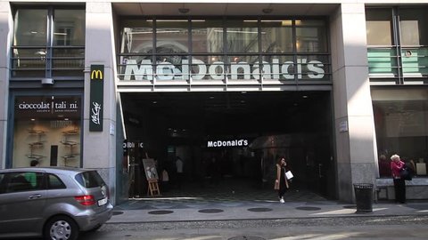 Milan, March 2018: Window of McDonald's fast food in the fashion and design capital of the world, on March 2018 in Milan, Italy, Europe