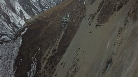 Shooting in 4k video from a drone at an altitude of about 4000 meters at sea level near the hiking trail to Lake Tilicho in the Himalayas snow mountains, Nepal.