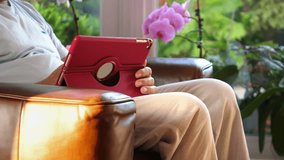 Professional videos of senior man using digital tablet in 4K slow motion 60fps