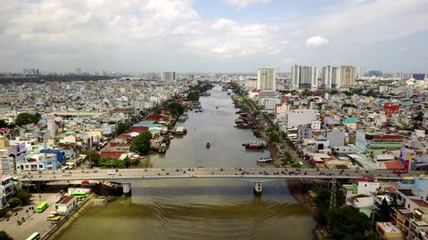 Aerial Drone - Traffic on Bride crossing the Kenh Te River in Ho Chi Minh City Vietnam - Circa September 2017