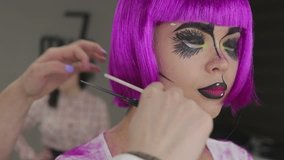 Makeup artist makes art makeup models