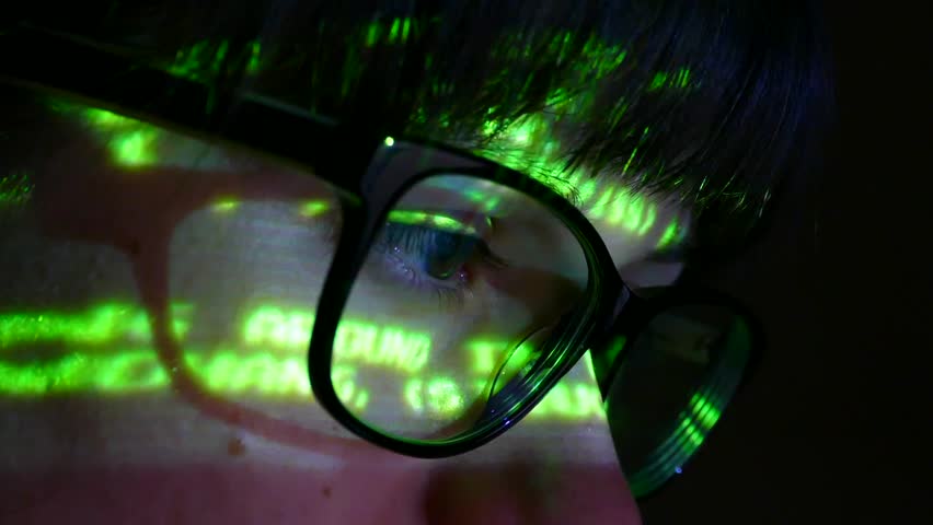 The programmer works at the computer over the program in a dark room. The hacker performs banned financial transactions with electronic money.. Royalty-Free Stock Footage #1009530830