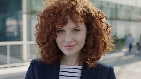 young redhead business woman portrait smiling happy successful intern campus