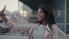 african american woman portrait business executive taking selfie in city