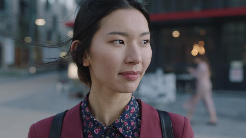 portrait of young asian student smiling in city close up of successful business intern
