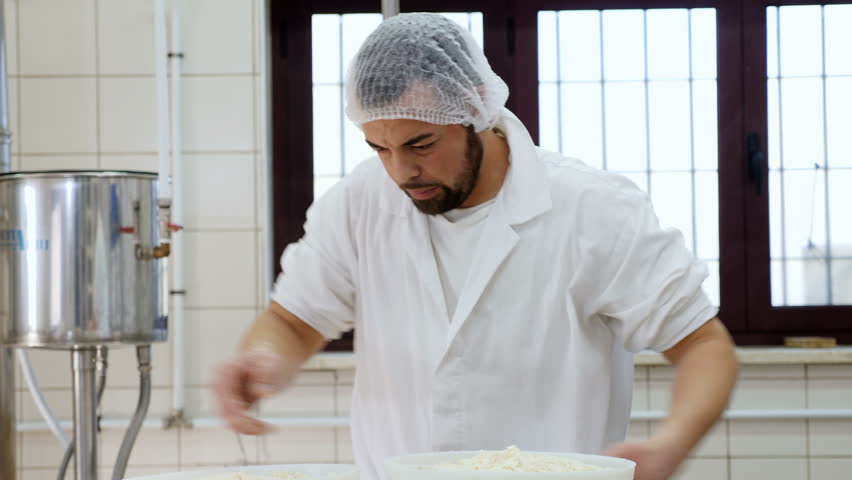 Diary man workin the cheese- Cheese factory