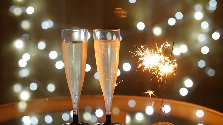 New Year Celebration with two champagne glasses and sparkler