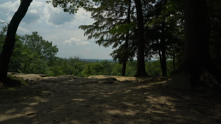Walking towards rock cliff at Ledges Overlook