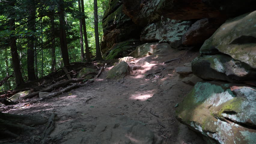 Pan up at beautiful large rock formation at Cleveland Ledges in Cuyahoga Valley
