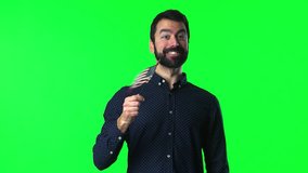 Handsome man with beard  holding an american flag on green screen chroma key