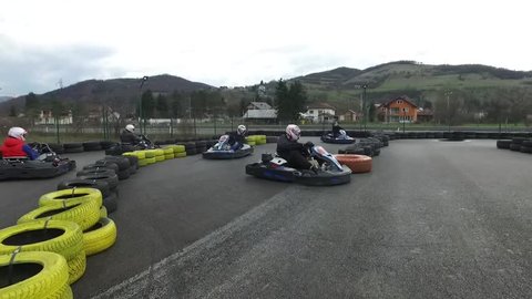 Kart racing or karting is a variant of open-wheel motorsport with small, open, four-wheeled vehicles called karts, go-karts. Footage of track and racing with karts. 