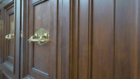 Closer look of the golden padlock in Rome Italy found on the brown huge door of the castle