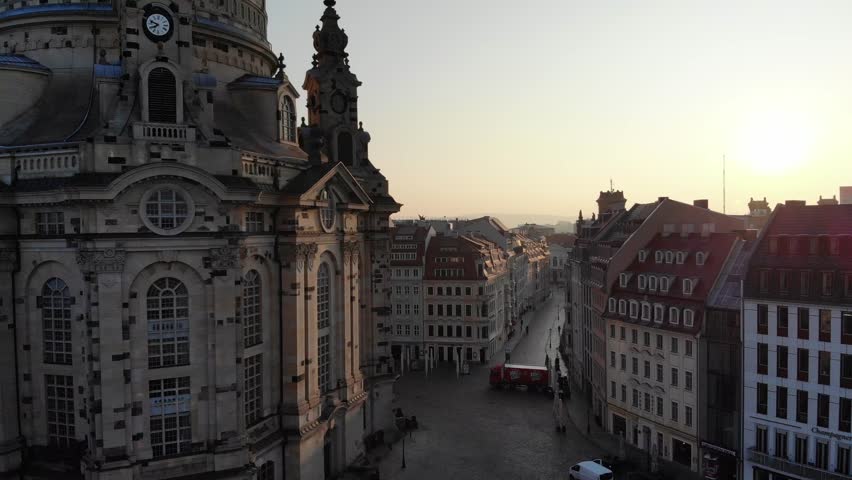 4K Aerial drone shot of sunrise in Dresden inner city with Frauenkirche, Hofkirche, Zitronenpresse with beautiful sun reflections and Elbe river | Shutterstock HD Video #1009571267