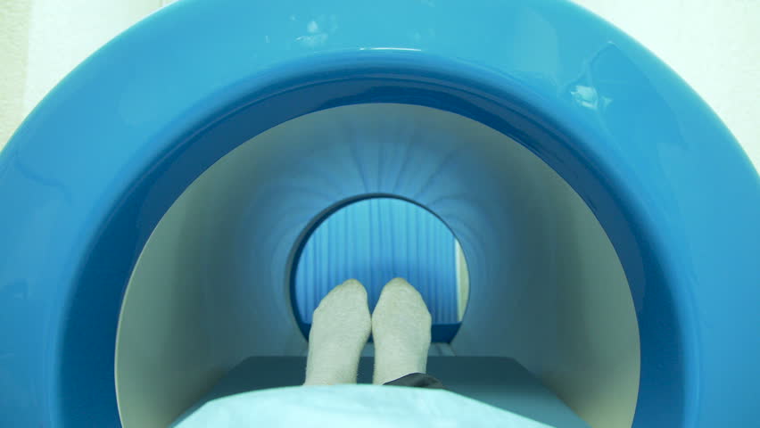 A patient moving into mri scan machine Royalty-Free Stock Footage #1009573859