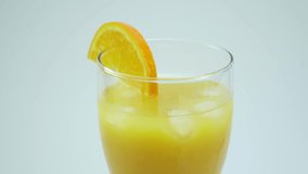 Fresh citrus fruits. Rotate Video footage of the concept of a healthy food and diet. Orange juice in a glass. 4K. 
