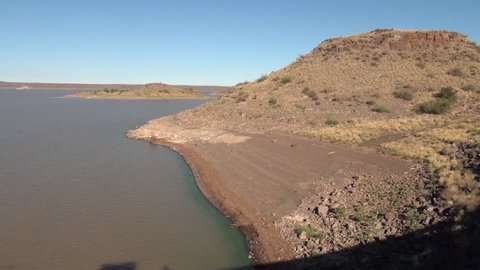 HD quality summer morning video of Hardap Dam Resort water reservoir surface and concrete dam wall located near town Mariental in the center-southern Hardap Region of Namibia, southern Africa