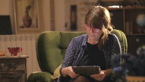 Mid age woman using tablet for online education