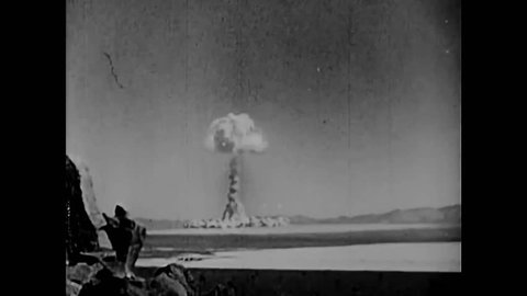 CIRCA 1958 - Albert Einstein and various scientists are shown at work and an atomic bomb explodes into a mushroom cloud in a desert in New Mexico.