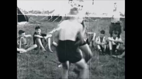 CIRCA 1937- German boys at a Nazi Youth camp in New York wrestle.