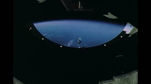 CIRCA 1969 - An on-board camera captures the view of the engine skirt and launch escape tower being separated from Apollo 11 in flight.