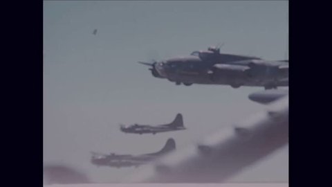 CIRCA 1940s-The Memphis Belle Flying Fortress flies in formation during WWII.