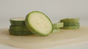 Healthy zucchini (Pepo cylindrica) on pile close-up 4K footage