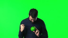 Handsome man with beard pressing yes button on green screen chroma key