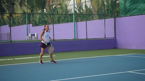 Slender girl sportswoman plays tennis. Slow motion. HD, 1920x1080