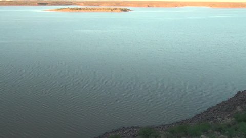 HD quality summer morning video of Hardap Dam Resort water reservoir surface and savanna plains beyond it located near town Mariental in the center-southern Hardap Region of Namibia, southern Africa